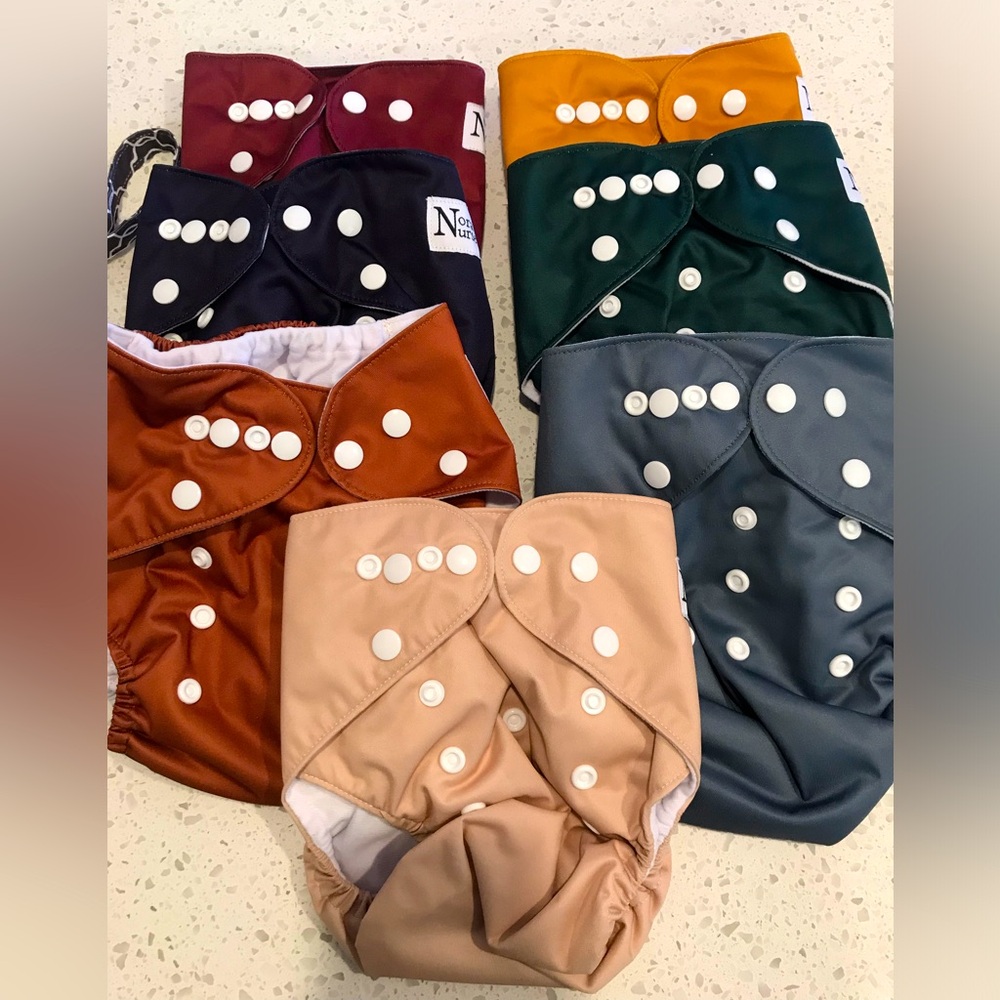 NWOT 7 Pack Nora’s Nursery Cloth Diapers, includes 20 inserts